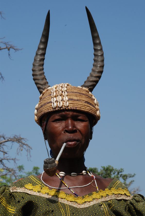 A Batammariba woman wearing a headdress made from Antelope horn and cowries